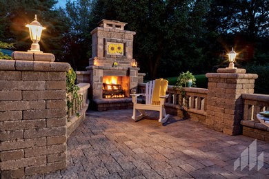 Inspiration for a large rustic backyard concrete paver patio remodel in Other with a fire pit and no cover