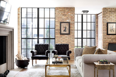 French country medium tone wood floor family room photo in Chicago with white walls, a standard fireplace and a wall-mounted tv