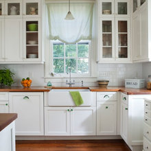 Butcher block countertops, white cabinets,