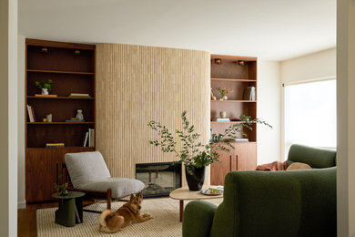 Inspiration for a large contemporary open concept dark wood floor and brown floor living room remodel in San Francisco with white walls, a standard fireplace and a stone fireplace