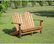 Linon Adirondack Wood Outdoor Double Bench in Acorn Brown
