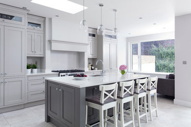 Inspiration for a mid-sized transitional u-shaped eat-in kitchen in Other with an undermount sink, recessed-panel cabinets, grey cabinets, grey splashback, stainless steel appliances and a peninsula.