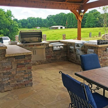 Outdoor kitchen on flagstone patio.