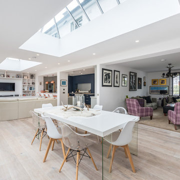 Kitchen in navy, white and grey with orange and copper accents