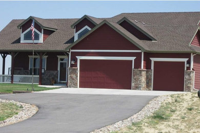 Large elegant red two-story wood exterior home photo in Denver with a clipped gable roof