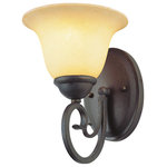 Trans Globe Lighting - Laredo 7" Wall Sconce - The Laredo Collection combines Spanish design themes with functionality. The Laredo 7" Wall Sconce offers both accent lighting and supplemental area lighting as it stands out and showcases your home's interior.  An Antique Bronze finished oval wall plate with beveled edge and a fancy scrolled arm support the bell shaped Crushed Stone glass shade, bringing new style to classic appeal.  The Laredo Collection includes a wide offering of matching indoor light fixtures, giving it added flexibility for use in any home.