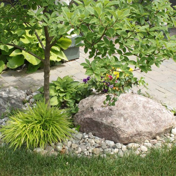 Lakefield, river rock garden and pavers entranceexteri