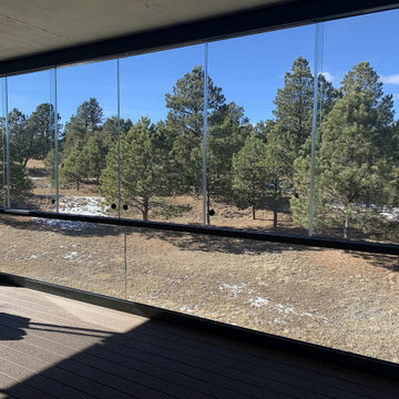 Sliding glass panels allow the space to opened up