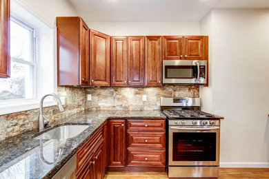 Enclosed kitchen - l-shaped enclosed kitchen idea in Philadelphia with an island