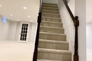 Example of a mid-sized transitional staircase design in Other