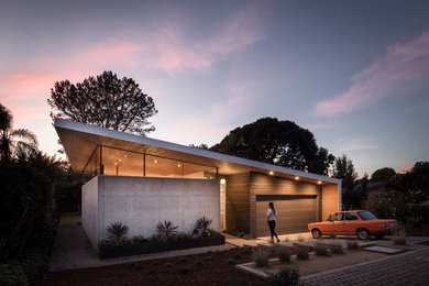 Modern black wood exterior home idea in San Diego with a shed roof