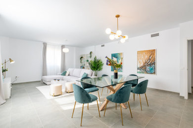 Photo of an expansive contemporary dining room in Seville with white walls, porcelain flooring and grey floors.