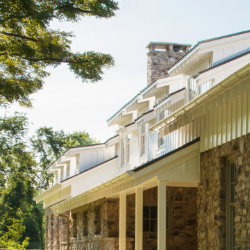 American Farmhouse with Board and Batten and Rustic Stone