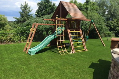 This is an example of a large transitional partial sun and drought-tolerant backyard outdoor playset in Toronto for summer.