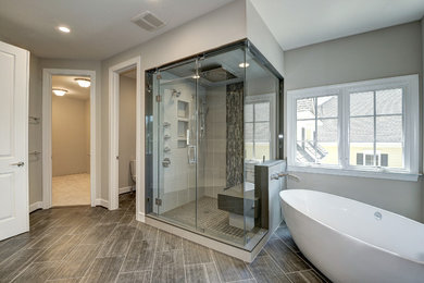 Large transitional master beige tile, black tile, gray tile and matchstick tile porcelain tile and gray floor bathroom photo in DC Metro with gray walls and a hinged shower door
