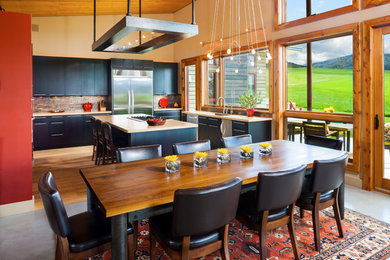 Example of a large trendy concrete floor and gray floor great room design in Other with beige walls and no fireplace