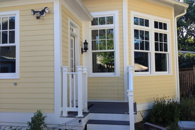 Elegant yellow two-story vinyl exterior home photo in DC Metro