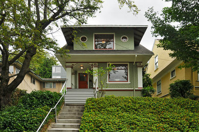 Arts and crafts green two-story exterior home photo in Seattle