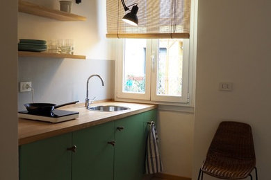 Photo of a small contemporary kitchen in Milan.