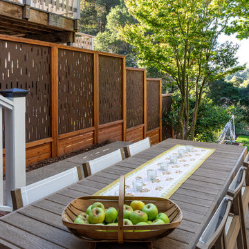 Outdoor al fresco dining near OutDeco wood panels for privacy