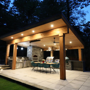 Modern Covered Outdoor Kitchen with Dining