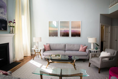 Inspiration for a large mid-century modern formal and open concept light wood floor living room remodel in New York with blue walls, a standard fireplace and a wood fireplace surround