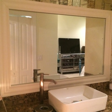Bathroom redo with framed mirror and antique mirror tiles