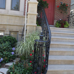 Solid stone stairs with ornamental iron railing - Products