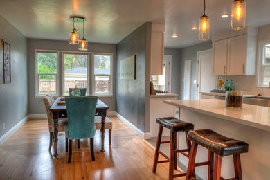 Kitchen/dining room combo - small shabby-chic style light wood floor kitchen/dining room combo idea in Sacramento with gray walls and no fireplace