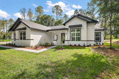 Example of a farmhouse exterior home design in Orlando