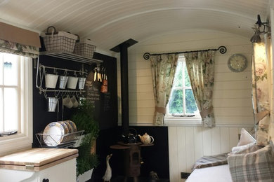 This is an example of a shabby-chic style kitchen in Other.