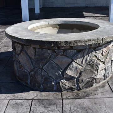 Stamped Concrete with Stone fire pit and stone wall