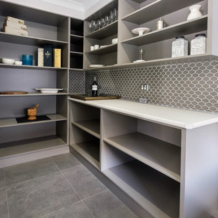 Contemporary kitchen pantry pictures - Example of a trendy l-shaped ceramic floor kitchen pantry design in Newcastle - Maitland with open cabinets, gray cabinets, laminate countertops, gray backsplash and ceramic backsplash