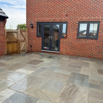 Mixed Sandstone Courtyard Between Brick and Fencing