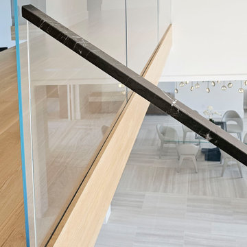 Project #107 | Freestanding Staircase with Marble Backdrop