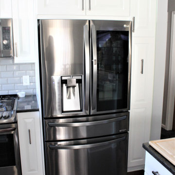 Showplace EVO Kitchen in Sierra Extra White w/ Slab Drawer Headers
