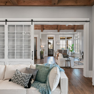 Luxury Modern Farmhouse Lower Level with Stone Fireplaces & Pool Views