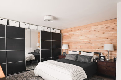 Trendy gray floor bedroom photo in Denver with beige walls