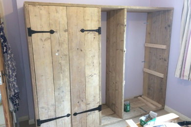 Reclaim scaffold wardrobe with salvaged hinges