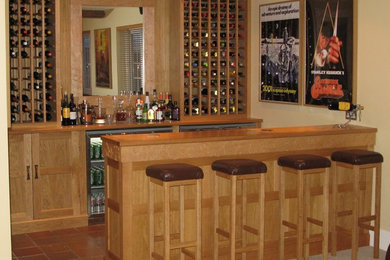 Inspiration for a farmhouse home bar in Other.