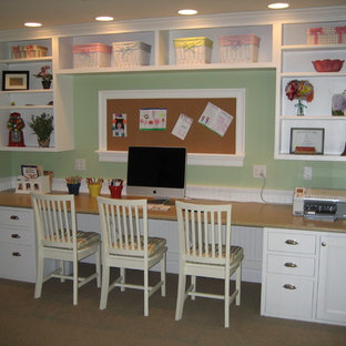 Inspiration for a medium sized contemporary look-out basement in Manchester with green walls and carpet.