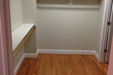 Mid-sized transitional medium tone wood floor closet photo in Raleigh with open cabinets