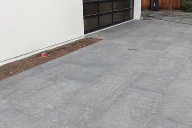 This is an example of a large contemporary backyard stone driveway in San Francisco.