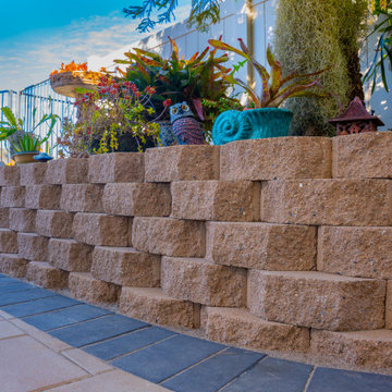 Elegant Outdoor Transformation with Retaining Wall & Paver Design