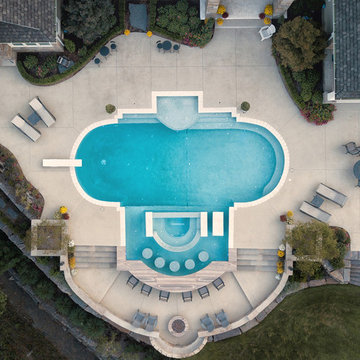 Geometric gunite pool with negative edge spa