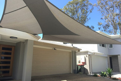 This is an example of an expansive modern attached two-car carport in Brisbane.