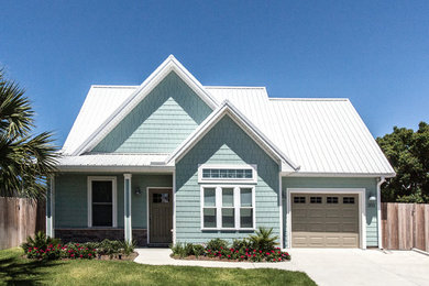 Small beach style blue two-story concrete fiberboard exterior home photo in Miami