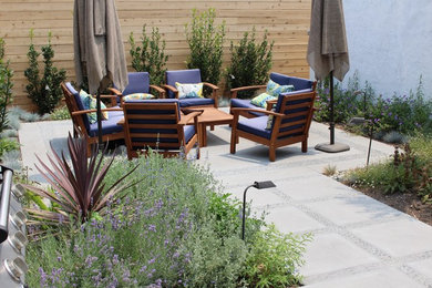 Small transitional backyard patio in Los Angeles.