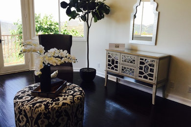 Foyer - transitional dark wood floor foyer idea in Los Angeles with beige walls
