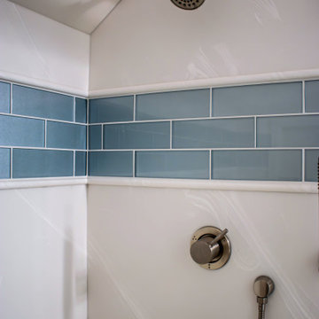 Guest Bathroom Featuring White Icing Vanity and Alabaster Marble Shower